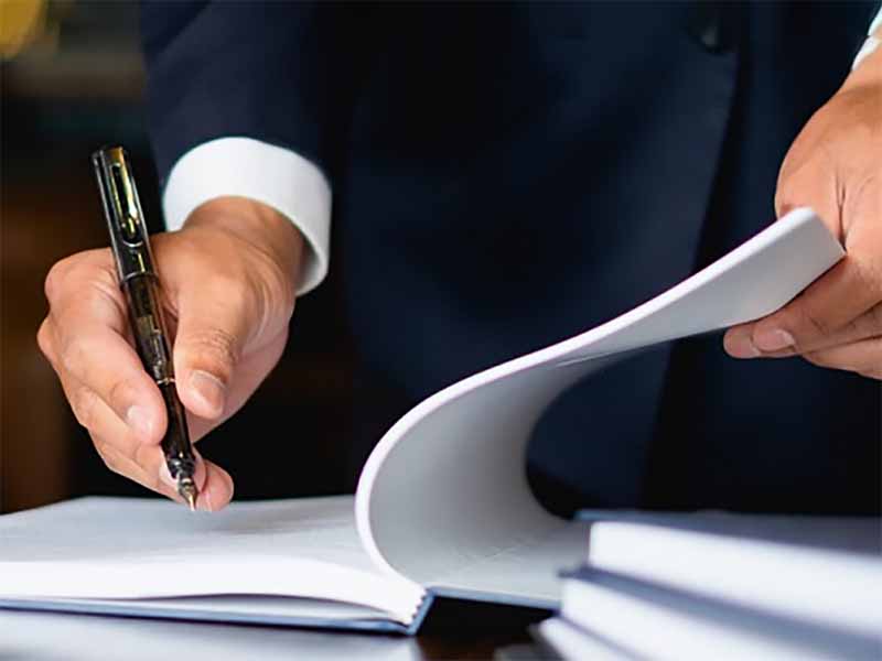 Extend the reach of your legal team - man signing document